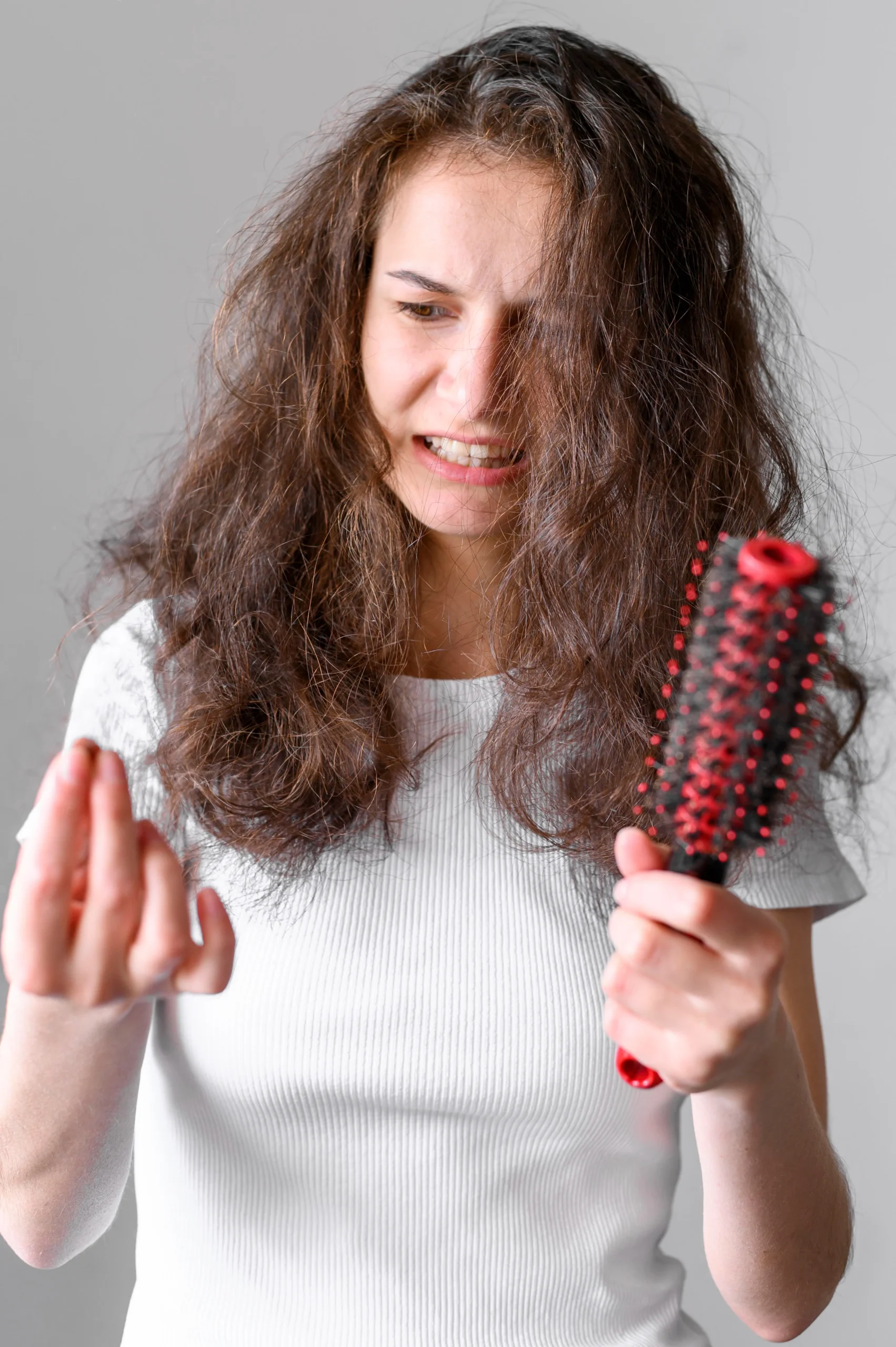 A lady worried about how to stop hair loss after perm