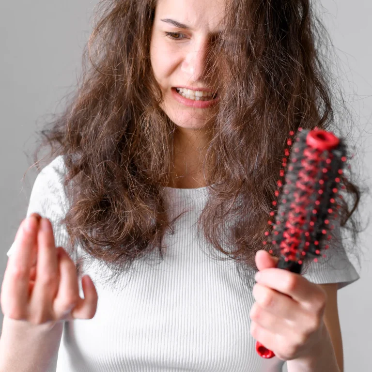 A lady worried about how to stop hair loss after perm
